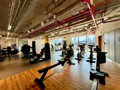 a gym with treadmills and cardio equipment in a room at Bright and Exquisite 1-Bedroom in Downtown views 2 in Dubai
