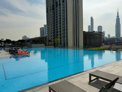 a large swimming pool on the roof of a building at Bright and Exquisite 1-Bedroom in Downtown views 2 in Dubai