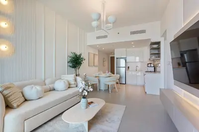 a living room with a couch and a table at Bright and Exquisite 1-Bedroom in Downtown views 2 in Dubai