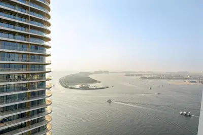 a view of a river from a tall building at Elegant 2BR with Palm & Sea View l Direct Beach Access in Dubai