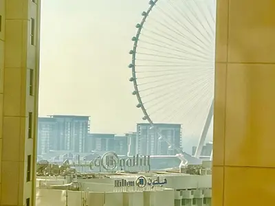 a large ferris wheel in the middle of a city at Bahar 6 in Dubai