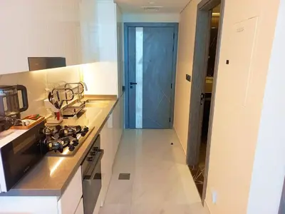 a kitchen with a stove and a counter top at Arjan Bright Studio w Resort Amenities Samana PV by Vibel in Dubai