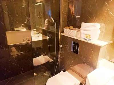a bathroom with a shower and a toilet and a sink at Arjan Bright Studio w Resort Amenities Samana PV by Vibel in Dubai