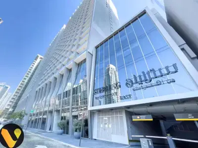 a building with a sign on the front of it at Vogue Downtown The Sterling by Omniyat, near Burj Khalifa and Dubai Mall, Studio Apartment with Balcony and Access to all Amenities in Dubai