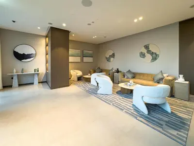 a living room with a couch and chairs at 1 Bedroom apt High end luxurios building Next to Dubai mall in Dubai