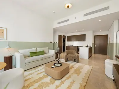a living room with a couch and a table at 1 Bedroom apt High end luxurios building Next to Dubai mall in Dubai