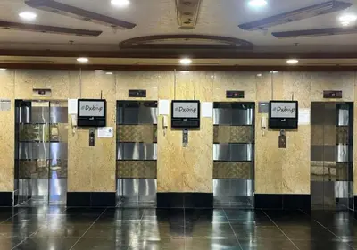 a row of lockers in a building with signs on them at The Junction Partition Room In Barsha Heights in Dubai