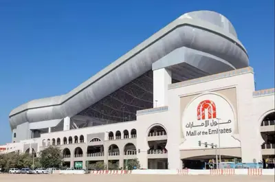 a large white building with a curved roof at Creative Partition Room in Barsha 1 Near Metro in Dubai