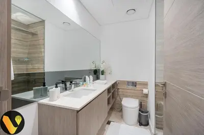 a bathroom with a sink and a mirror at Vogue Downtown The Sterling by Omniyat, near Burj Khalifa and Dubai Mall, Studio Apartment with Balcony and Access to all Amenities in Dubai
