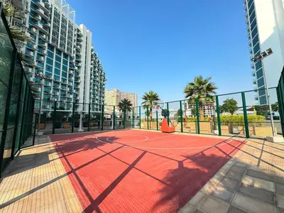 a tennis court in the middle of a city at Modern Studio 15mins away From World Trade Center in Dubai