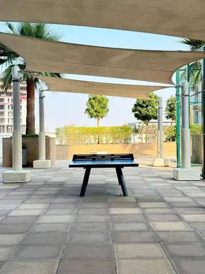 a bench under a pavilion in a park at Modern Studio 15mins away From World Trade Center in Dubai
