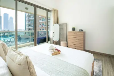 a bedroom with a large white bed and a large window at Frank Porter - Marina Park in Dubai