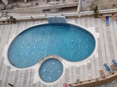 an overhead view of a large swimming pool at The One by Anu in Dubai
