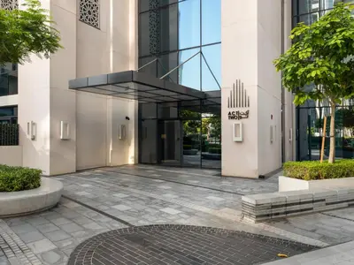 an entrance to a building with a glass revolving door at The Chic Downtown Suite Luxury near Burj Khalifa in Dubai