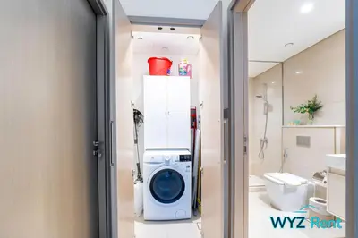 a bathroom with a washer and a washing machine at Sleek 1BR w Canal Views Next to Dubai Mall in Dubai