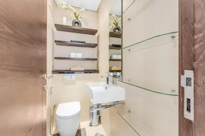 a bathroom with a white toilet and a sink at Dubai Marina Elegant 1 BR on the Canal in Dubai