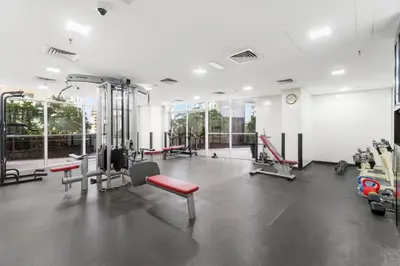 a gym with treadmills and machines at Stunning 1 BR in JBR Dubai Marina The Walk in Dubai