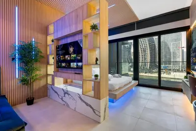 a bedroom with a bed and a large window at Exclusive Apt 4 Pex with Burj Khalifa View in Dubai