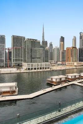 a body of water with a city in the background at Exclusive Apt 4 Pex with Burj Khalifa View in Dubai
