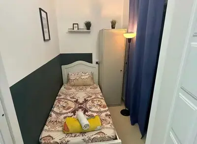 a small bedroom with a small bed in a room at Gateway Partition Room in Barsha Mashreq Metro in Dubai