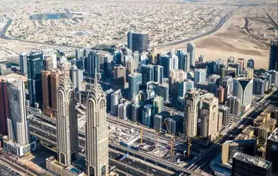 an aerial view of a large city with tall buildings at Cityscape Room In Tecom Near ICM Metro in Dubai