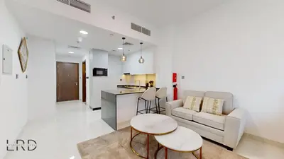 a living room with a couch and a table at Modern Furnished Studio in Dubai
