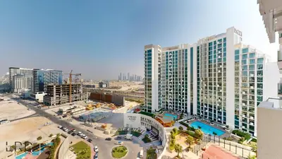 an aerial view of a large apartment building at Stylish Studio Retreat in Azizi Farhad in Dubai