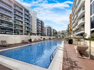 a swimming pool in the middle of a building at Chic & Beautiful Home in the Heart of Meydan in Dubai