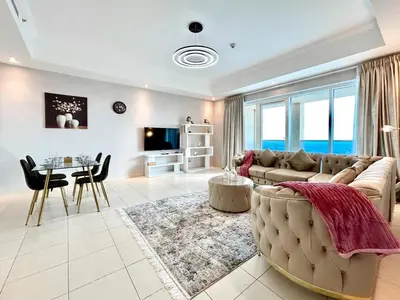 a living room with a couch and a table at Homes 2 Retreat - Luxury & Spacious 1BR with Balcony in Business Bay in Dubai