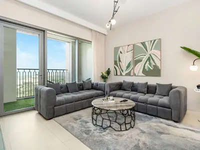 a living room with a couch and a table at Royal Vista - Luxury 4BR Apartment at Downtown Views II - Downtown in Dubai