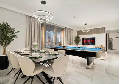 a dining room with a pool table and a billiards at Royal Vista - Luxury 4BR Apartment at Boulevard Point - Downtown in Dubai