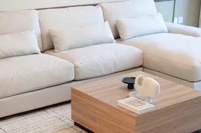a living room with a couch and a coffee table at Downtown Chic 2 Bedroom Apartment I Dubai Mall Access I Views of Burj Khalifa from Pool I Free Parking, Gym, Pool & Wi-Fi I by Meerak in Dubai