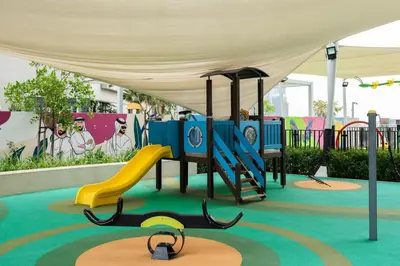 a playground with a slide and a slideintend at KeyRock Luxury Apartment at Aykon Tower with Views in Dubai