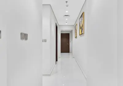 a hallway of a building with white walls at 2BR Central Apt in Business Bay Noble Tower in Dubai