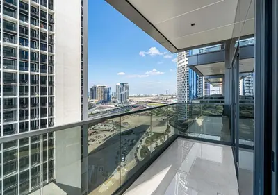 a view of the city from the balcony of a skyscraper at 2BR Central Apt in Business Bay Noble Tower in Dubai