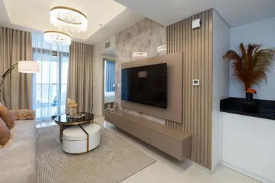 a living room with a flat screen tv and a living room at Keyrock Living - Luxury Stay in Business Bay in Dubai