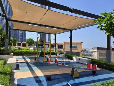 a play area with awning and a playground at Near Burj Khalifa, Dubai Fountain, Dubai Mall in Downtown in Dubai
