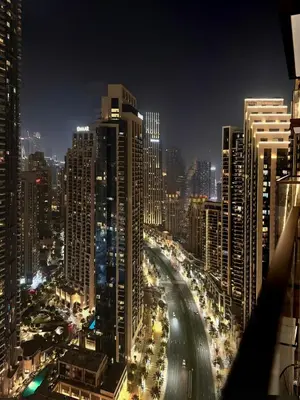 a view of a city at night with traffic at Near Burj Khalifa, Dubai Fountain, Dubai Mall in Downtown in Dubai