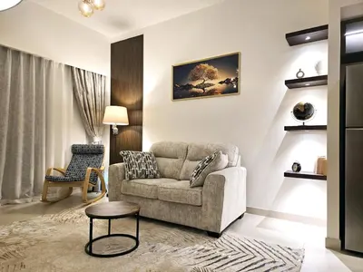 a living room with a couch and a chair at Near Burj Khalifa, Dubai Fountain, Dubai Mall in Downtown in Dubai