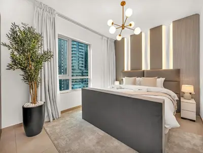 a bedroom with a large bed and a large window at WonderfulStay at The Residences - Best Burj Khalifa & Fountain View - Brand New Luxury Apartments in Dubai