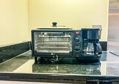 a toaster oven sitting on top of a counter at DreamShoma- Front-row Burj Khalifa & Fountain Show in Dubai