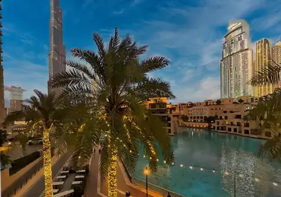 a view of a river in a city with buildings at DreamShoma- Front-row Burj Khalifa & Fountain Show in Dubai