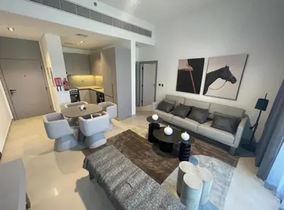 a living room with a couch and a horse on the wall at Brand New Designer 1-Bedroom Apartment With Free Parking in Dubai