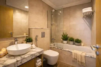 a bathroom with a sink and a toilet and a tub at KeyRock Elegant Aykon Apartment with City Views in Dubai