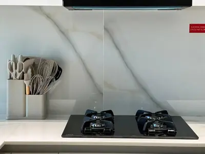 a kitchen with two burners on a stove at Cozy 1br Apartment In Jvc Free Parking & Pool in Dubai