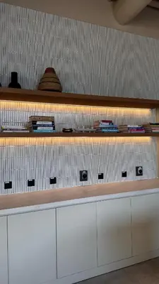 a counter in a room with white cabinets at Upside living business bay best in Dubai