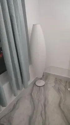 a white vase sitting on the floor next to a window at Ahlan Premium Spacious Luxury Furnished 2 Bedroom Apartment Marina Beach JBR for Families and Groups in Dubai
