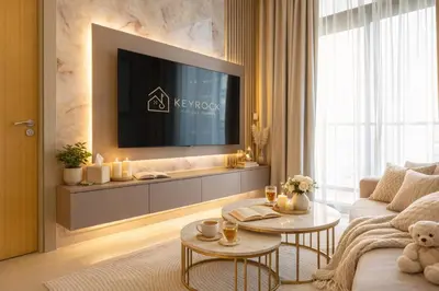 a living room with a tv on a wall at KeyRock Luxury 2BR Apartment with City Views in Dubai