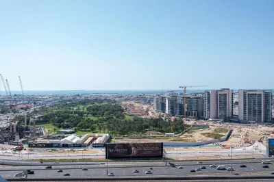 an aerial view of a city with a highway at Keyrock Living - Elevated Luxury in Business Bay in Dubai