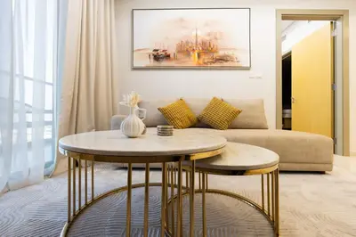 a living room with a table and a couch at Keyrock Living - Elevated Luxury in Business Bay in Dubai